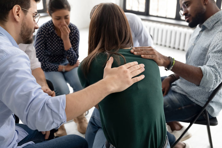 soothing woman in group