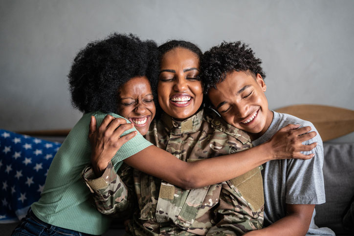 veteran mom embracing her kids