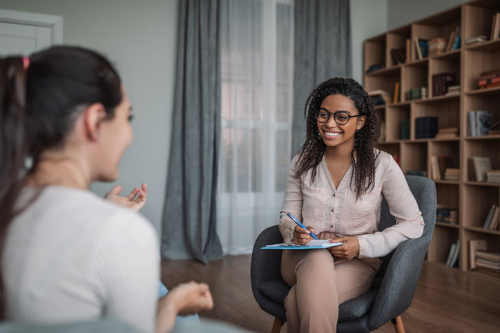 social worker talking with teen girl