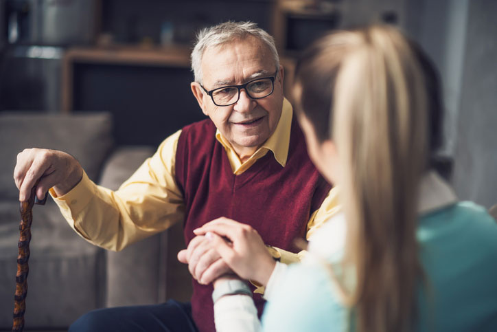 senior man talking with social worker