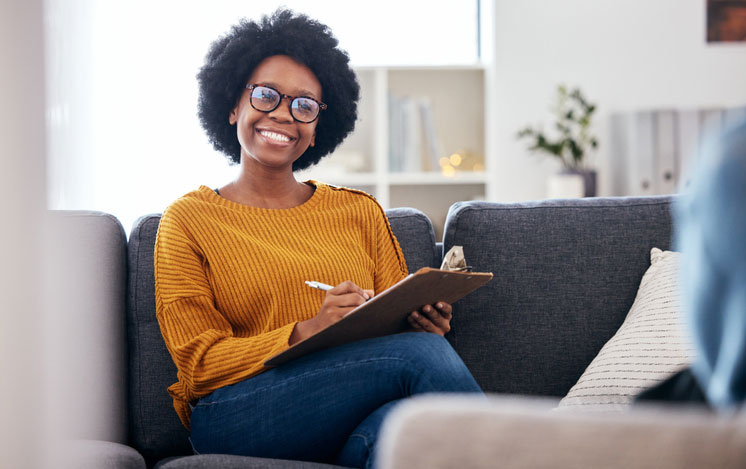 smiling social worker on couch