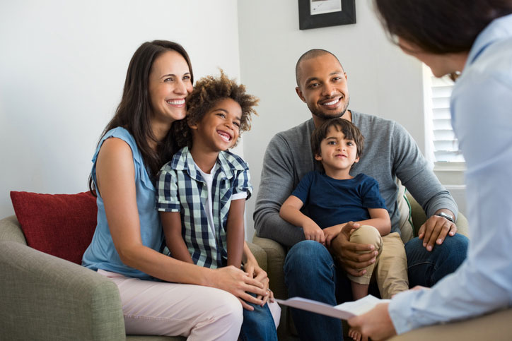 happy family talking with social worker