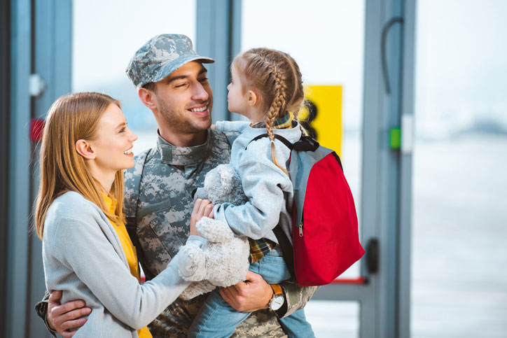 young family with soldier dad