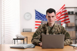 soldier on computer in office